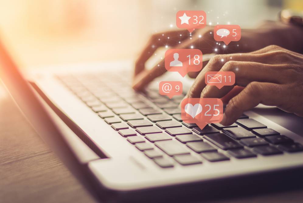 Digital marketing personalization" - Image of a person interacting with a personalized website. Alt: A person on a laptop using a personalized website for digital marketing. Image by WAID3 IT Solution